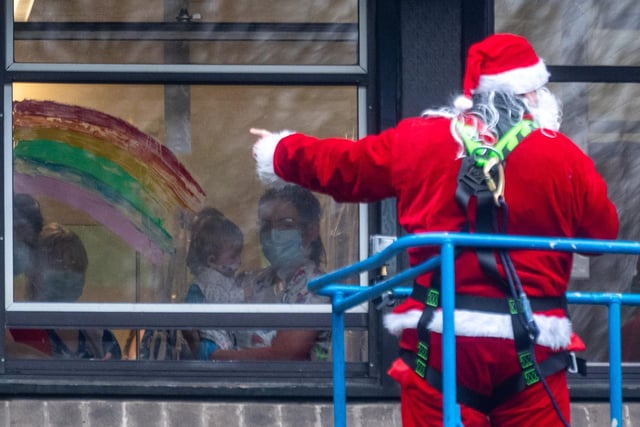 It was a quiet Christmas for many in Leeds this year, with the three-family bubble policy reduced to just Christmas Day. Staff at Leeds Children's Hospital were worried that patients would miss out on Santa, so they hoisted Father Christmas onto a cherry picker outside hospital windows to wave through the windows.