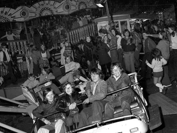 Youngsters of Shevington enjoy the visiting fairground rides in 1973