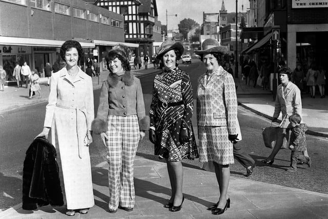 An impromptu fashion line up by ladies from Debenhams Wigan, promoting a forthcoming show at the store on Standishgate in 1973