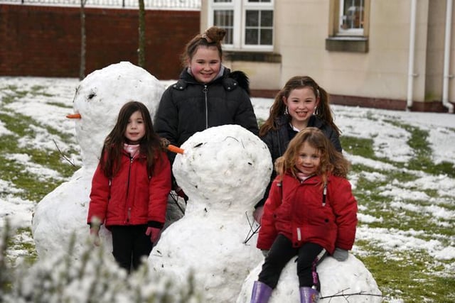 Ellie (11), Evie (9), Ella (6) and Ruby (3) with their snow-family in Buckshaw Village
