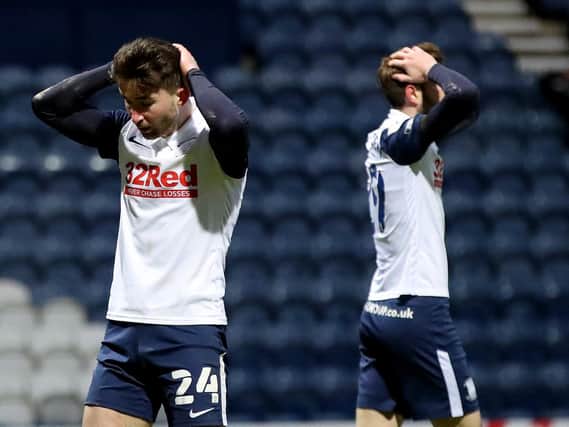 Sean Maguire and Tom Barkhuizen hold their heads.