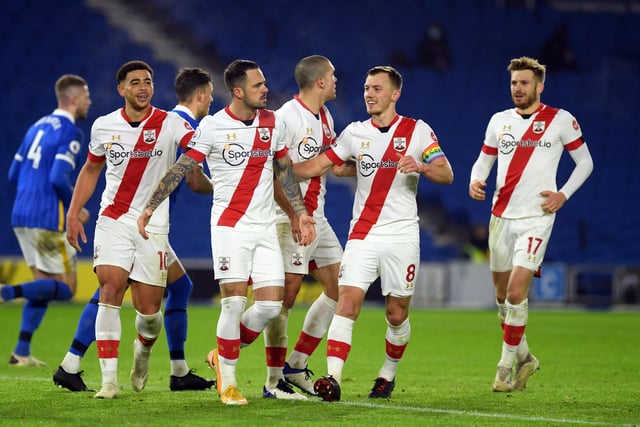 Danny Ings of Southampton celebrates after scoring from the penalty spot with Che Adams and James Ward-Prowse during the Premier League match against Brighton & Hove Albion at American Express Community Stadium on December 07, 2020.