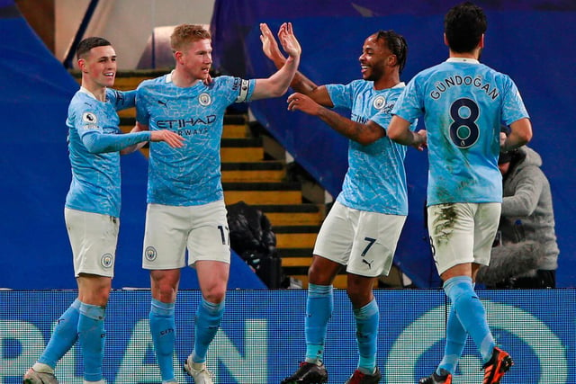 Manchester City's English midfielder Phil Foden celebrates with teammates after scoring their second goal during the English Premier League football match against Chelsea at Stamford Bridge in London on January 3, 2021.