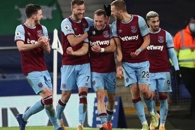 West Ham United's Czech midfielder Tomas Soucek celebrates with teammates after scoring in the English Premier League football match against Everton at Goodison Park in Liverpool, north west England on January 1, 2021.
