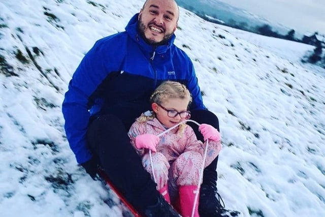 Roux Glass enjoys sledging with her daddy Ryan