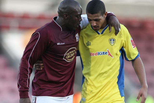 Northampton Town's Adebayo Akinfenwa talks to Jermaine Beckford at the end of the Coca Cola League One clash at the Sixfields Stadium in February 2008. The game finished 1-1 with Jonny Howson scoring for the Whites.