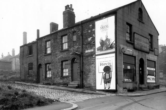 October 1962 and pictured is Albert Street which has two houses remaining. The off-licence shop was licenced to Beatrice Brotton. Moseley Street is on the right. Ridge Road continued onto Woodhouse Ridge.