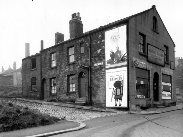 October 1962 and pictured is Albert Street which has two houses remaining. The off-licence shop was licenced to Beatrice Brotton. Moseley Street is on the right. Ridge Road continued onto Woodhouse Ridge.
