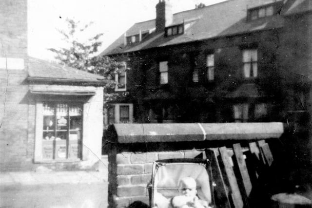 A view looking from number 1 Bagby Street, with a baby in a pram, across to Woodcock's greengrocers shop in 1966. This was on the corner of Bagby Street and St Marks Road.