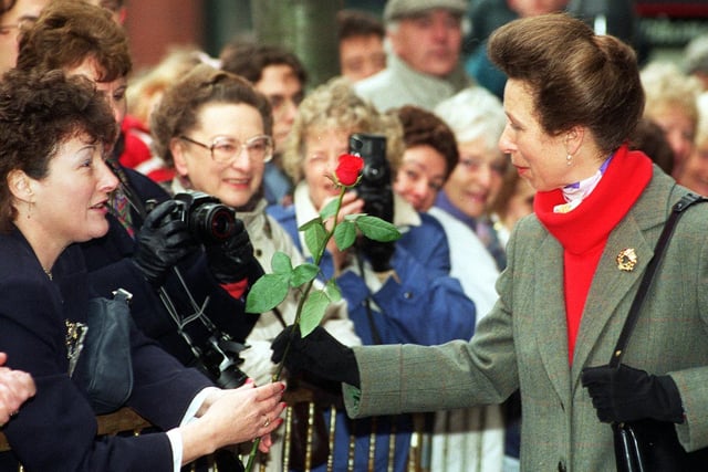 The Princess Royal accepts a red rose from Hazel Wales as she arrived at Direct Line House in Leeds.