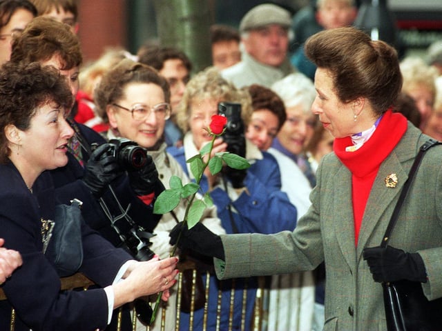 The Princess Royal accepts a red rose from Hazel Wales as she arrived at Direct Line House in Leeds.