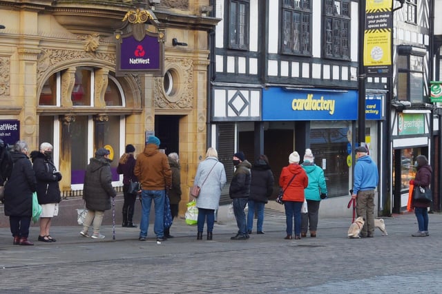 People queuing for the banks on Standishgate, Wigan.