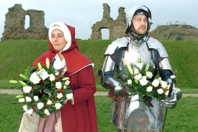 Volunteers from the Towton Battlefield Society the Company of Palm Sunday 1461 lay wreaths in memory of the Battle of Wakefield in 2005. Helen Cox and Stuart Ivinson hold the wreaths for the Yorkists and Lancastrians in front of Sandal Castle.