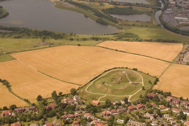 An aerial view of the castle site, including the village of Sandal and, in the background, Pugneys Country Park, in June 2004.