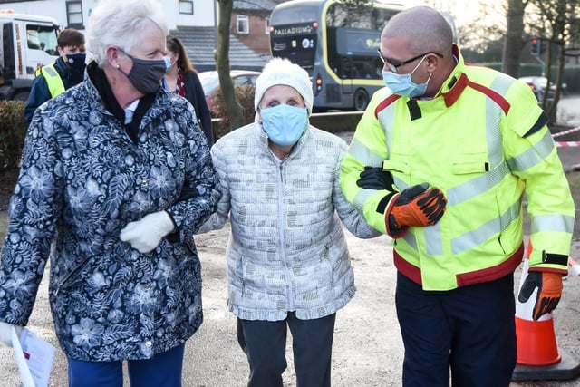 Winnie Witty (centre) is helped to her car by Maureen Hudson, and station manager Mark Warwick from Lancashire Fire and Rescue. Photo: Daniel Martino for JPI Media.