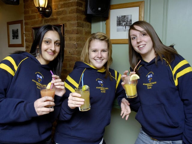 Student friends Raj, Alex and Sam wind down after netball training, in 2008.