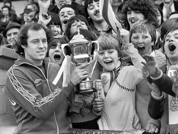 Wigan Athletic goalkeeper John Brown, shows his Player of the Year trophy to fans before the match against Halifax Town at Springfield Park in the Division 4 fixture on Saturday 12th of April 1980.  Latics won the match 3-1 with Neil Davids, Peter Houghton and Mick Quinn getting the goals.