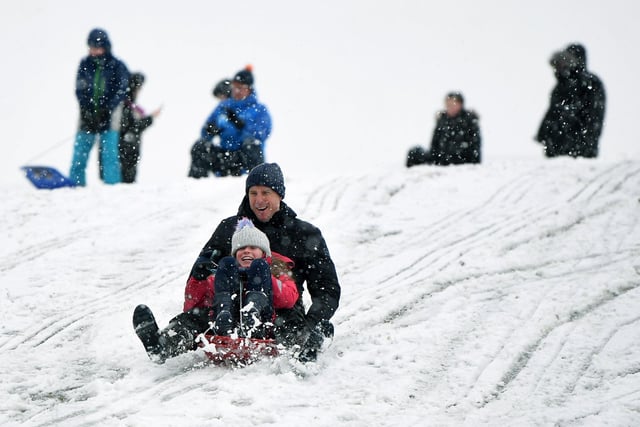 Russell Martin and his daughter Eva, 10, have fun in the snow in Roundhay Park