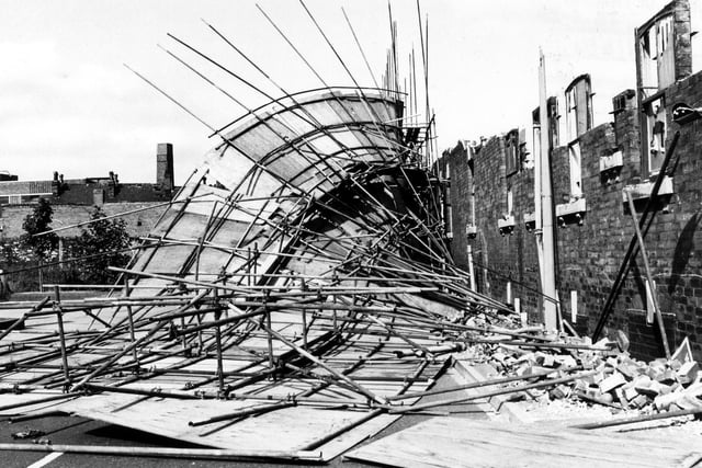 June 1986 and pictured is the demolition of an industrial building on Manor Road, next to the junction with David Street in Holbeck.