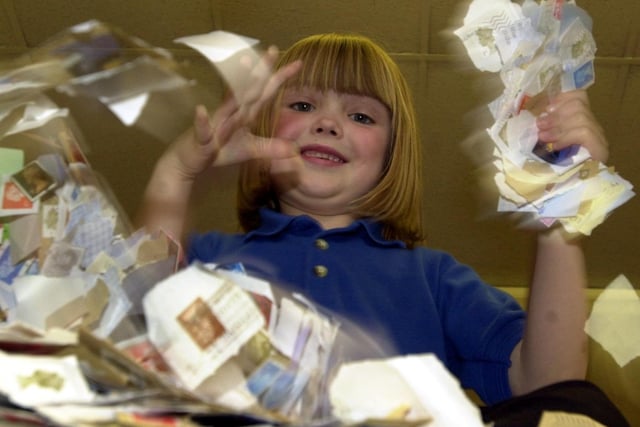Melissa Hyde from Tinshill Primary with 10,000 stamps that had been collected for Blue Peter.