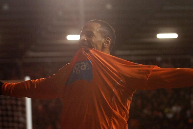 DJ Campbell celebrates with Blackpool's supporters