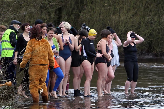 The ladies stand ready to take to the water, in the annual Todmorden Swimming Club New Years swim