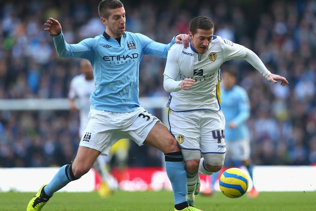 Ross McCormack battles with Manchester City's Matija Nastasic during the FA Cup firth round clash at the Etihad Stadium in February 2013.