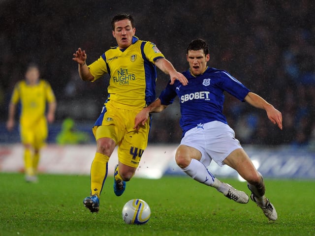 Cardiff City's Mark Hudson slides in to tackle Ross McCormack during the Championship clash at Cardiff City stadium in January 2011.