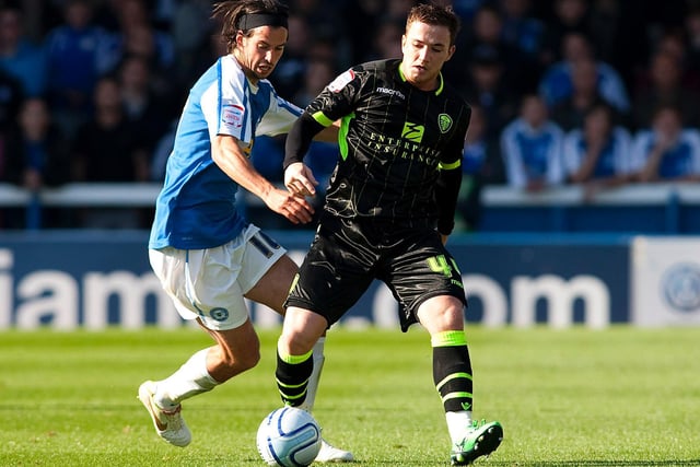 Ross McCormack holds off the challenge of Peterborough's George Boyd during the Championship clash at London Road in October 2011.