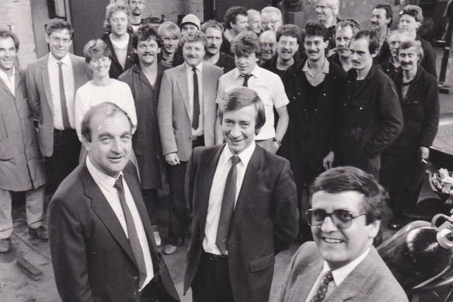 Three directors of Davenport Metal Fabrications - David Oliver, David Preston and Arthur Waud - with some of the workforce in September 1986.