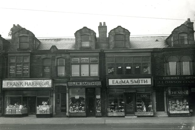 Lytham Road shops close to the junction with Waterloo Road. According to a plaque this terrace of shops was built in 1892. Seen here in the 1950s the shops include from the left Greenhalgh's ladieswear ( only partly seen), Frank Harbron grocers, J.W. Smith  menswear, E.A. & M.A. Smith bakery and cafe and J.L.Dawson Cook dispensing chemist and opticians.