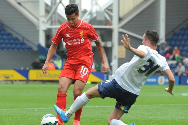Alan Browne tackle Phillipe Coutinho in PNE's friendly against Liverpool at Deepdale in July 2014