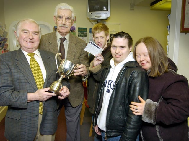 Max Payne (left) presents a trophy and £100 to Scarborough MENCAP vice-chairman Chris Lumley, Shaun Davies, Peter Robertshaw and Georgina Turner.