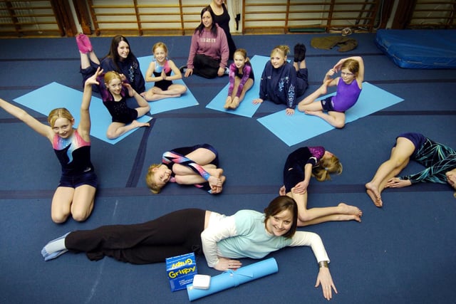 Lynda Wilson, front, who has opened a yoga shop in the Market Vaults, donates yoga mats and gym grip blocks to Scarborough Gymnastics Academy.