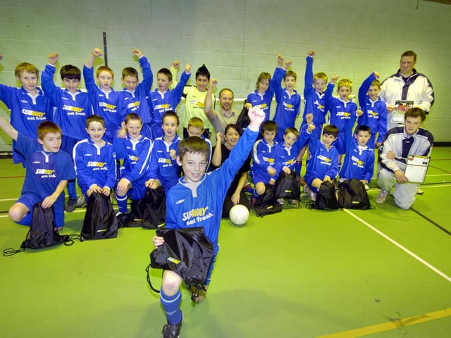 Scarborough & District U11s football team get their new strip, sponsored by Scarboro Subway shop – the lads celebrate with sponsor, franchisee Darren Kirk (middle) with Subway manager Zoe Darley.