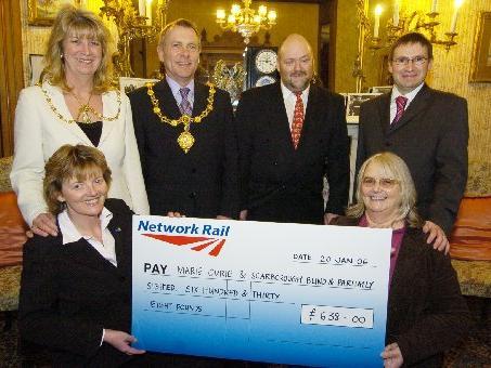 Serco Defence present cheques to local charities: Cheryl Barrett of Marie Curie, Brian Heald and Viv Wright of Scarborough Blind and Partially Sighted Society.