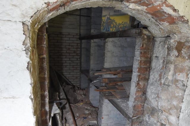 The archway had been bricked up for decades but after taking it apart, brick by brick, staff found an old wine cellar dating back to the 1960s