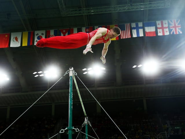 Nile Wilson competes on the horizontal bar during the men's team final on Day 3 of the Rio 2016 Olympic Games.