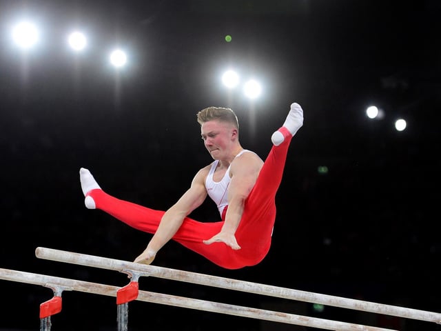 Nile Wilson performs on the parallel bars during the Team Final and Individual qualification of the Artistic Gymnastics event during the 2014 Commonwealth Games in Glasgow in July 2014.