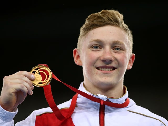 Gold medalist Nile Wilson poses during the medal ceremony for the Men's Horizontal Bar Final at SSE Hydro during day nine of the Glasgow 2014 Commonwealth Games in August 2014.