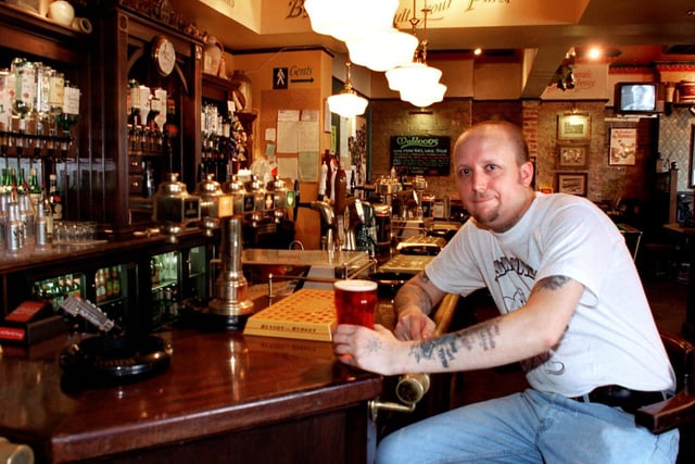 Landlord of Mighty Muldoons, Chorley, Tony Baker at his bar which is included in the Pubs of Distinction, Pub Guide.
