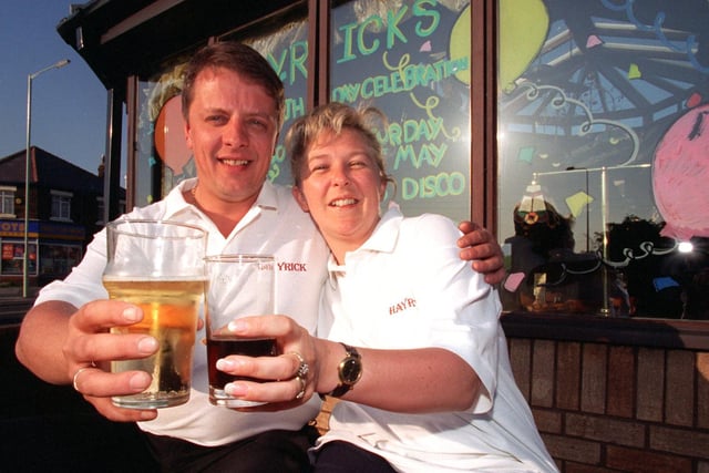 Landlord and lady of the Hayrick, Clayton Le Woods, Mike and Lesley Dean toast the success of of their pub during it's 20th birthday celebrations.