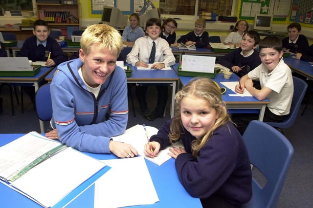 Thorner Primary was celebrating after receiving a good OFSTED report. Pictured is teacher Sam Capstick next to Kathryn Maycock, 10, with Year 6 pupils looking on.