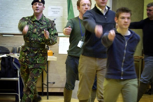 Regimental Sergeant Major Tony Donahue puts the cast of The Accrington Pals through their paces during rehersals at West Yorkshire Playhouse.