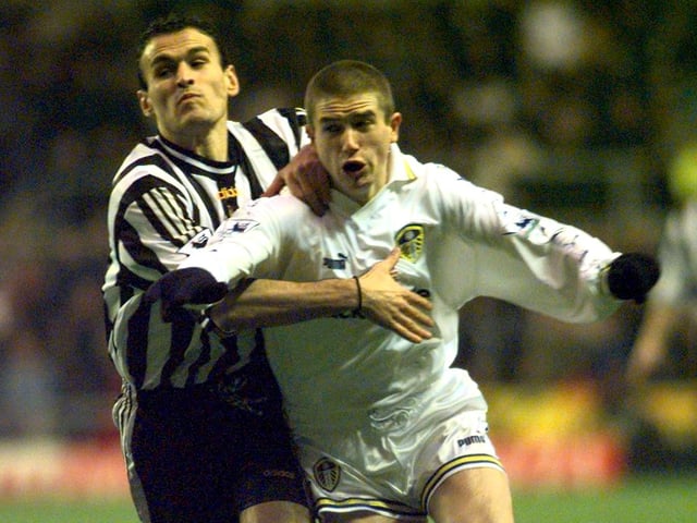 Harry Kewell fights past Nikolaos Dabizas.