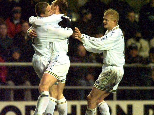 Harry Kewell celebrates his goal with David Hopkin and Alf Inge Haaland.