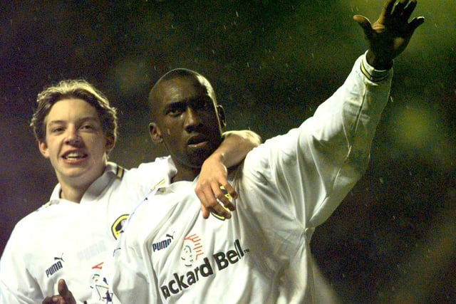 Jimmy Flotd Hasselbaink celebrates his goal with Alan Smith.