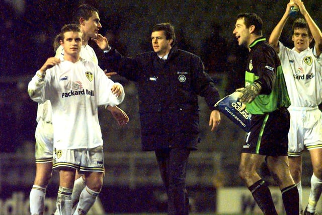 David O'Leary celebrates with his Leeds United team at full time.