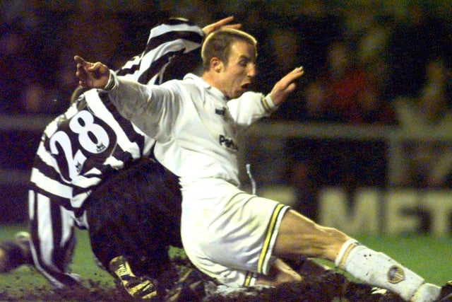 Lee Bowyer slides past Aaaron Hughes to score Leeds United's second goal.