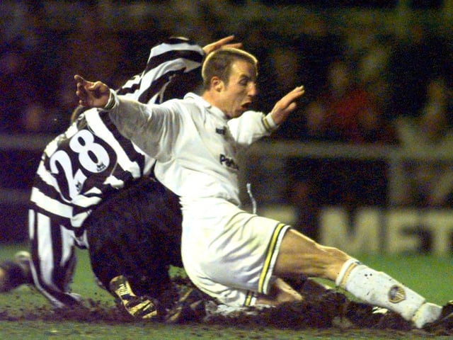 Lee Bowyer slides past Aaaron Hughes to score Leeds United's second goal.